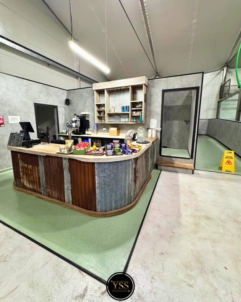 Brightly cleaned bar area with polished surfaces and fresh flooring.