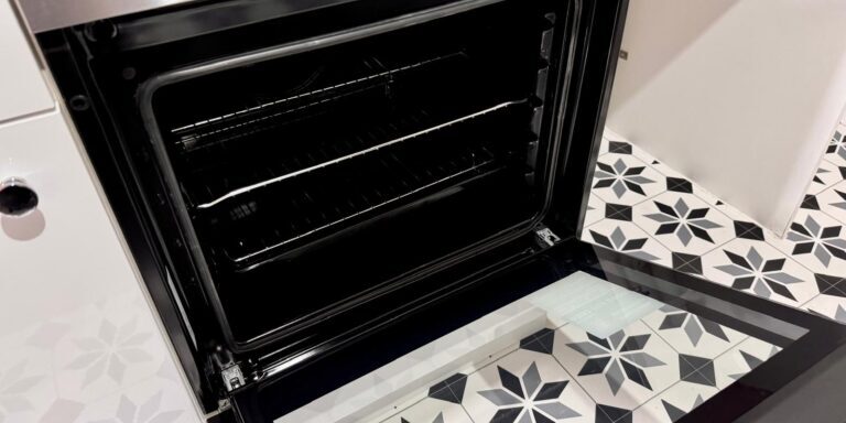 Sparkling oven cleaning service in progress for a spotless kitchen appliance.